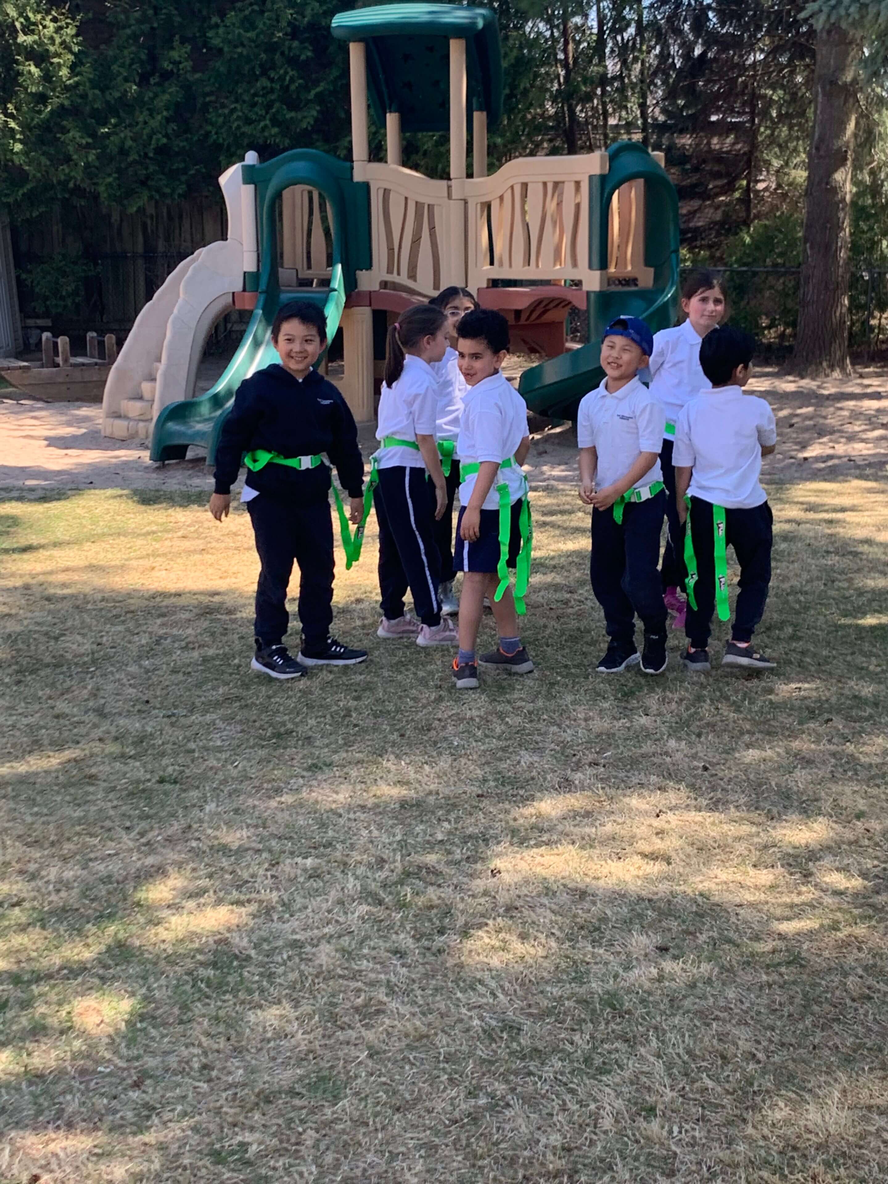 Children playing near a playground structure.